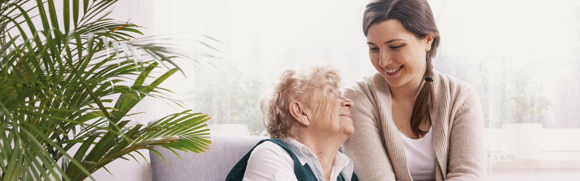 Senior lady sitting in armchair at nursing home,